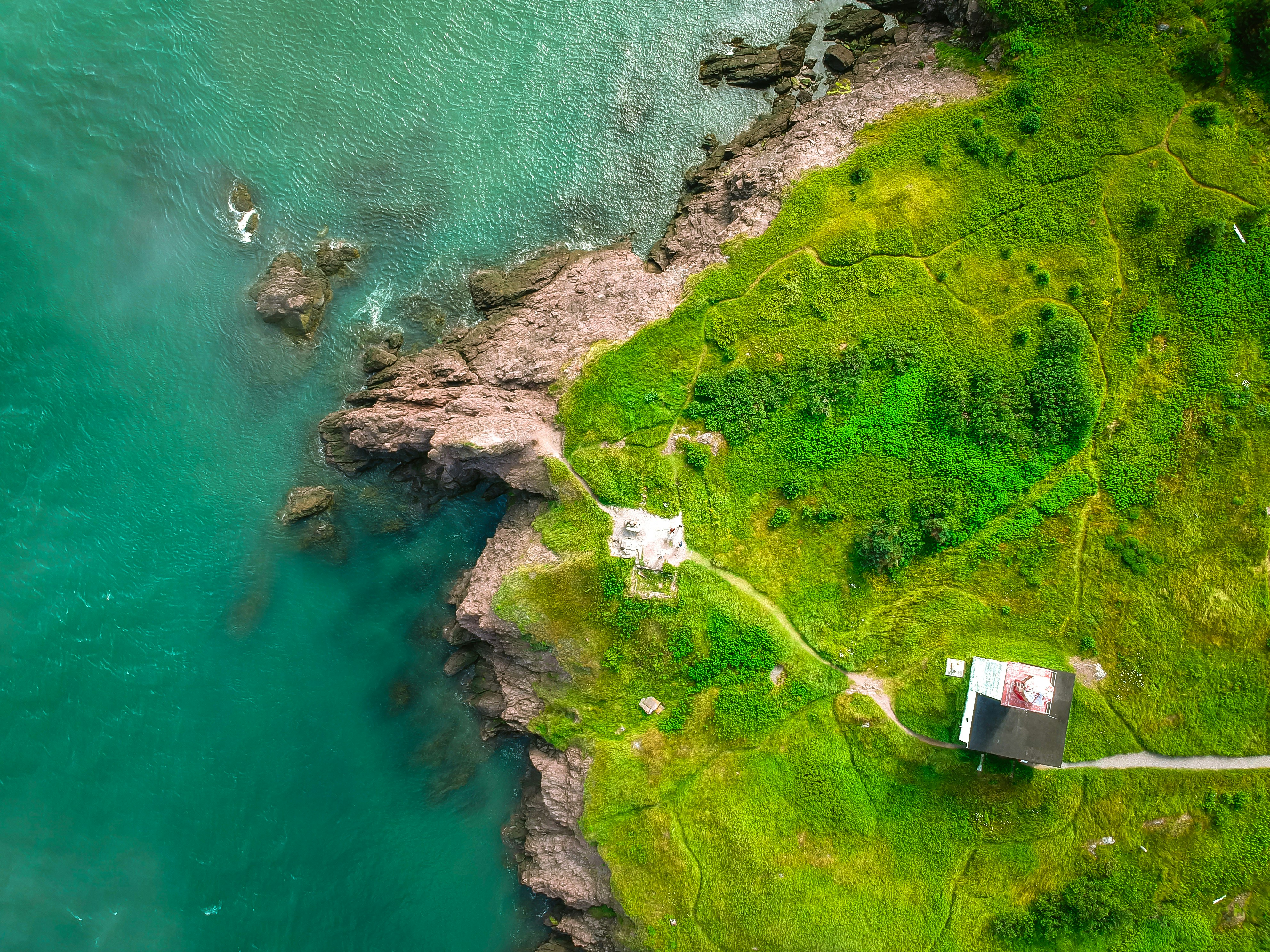 aerial photography of rocky mountain near sea